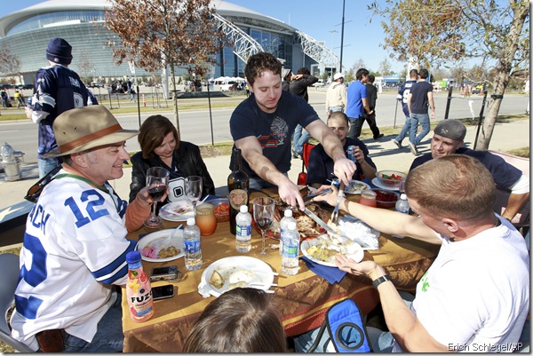 Somehow, these people appeared to have a better dinner on some table in the parking lot of a stadium than I had in a semi-legitimate house. I do, however, also drink "Fuze"